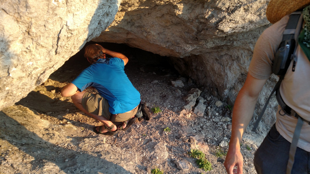 Peering into one of the caves.