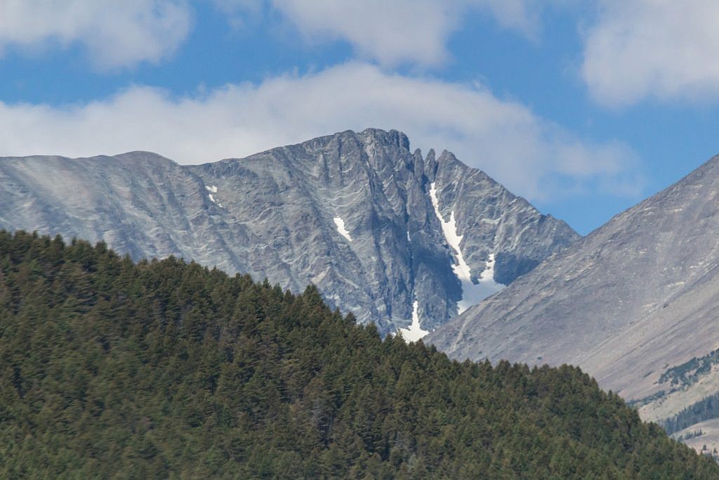 Crazy Peak (11,200′). The traverse between the false summit (right) and the actual summit (left) makes it a challenging climb but it can supposedly be done without ropes.