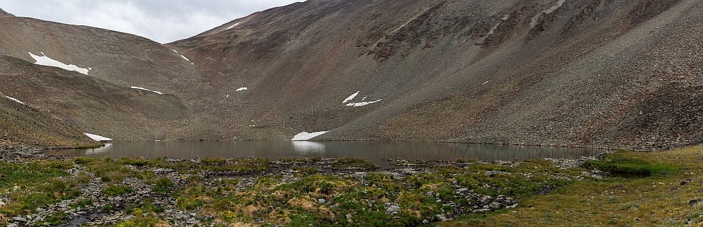 The unnamed lake. Still no goat sightings. Hoping for more luck we decided to continue onward towards the saddle to the left to get a view of the other side.