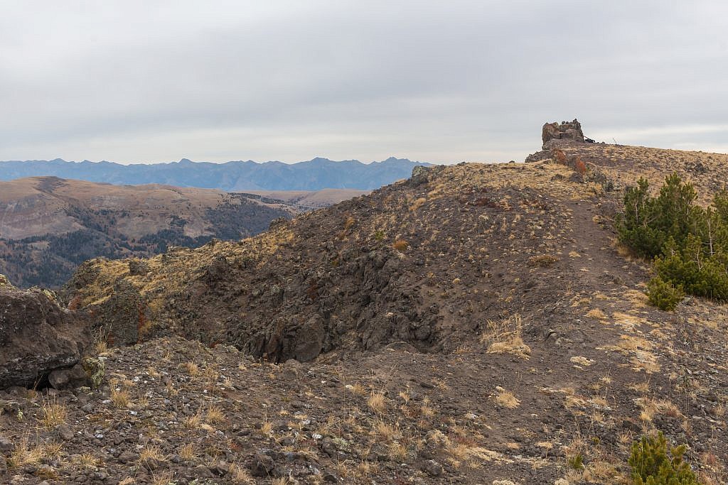 Looking east towards the summit of Black Butte which is marked by the large cairn. Madison Range in the distance.