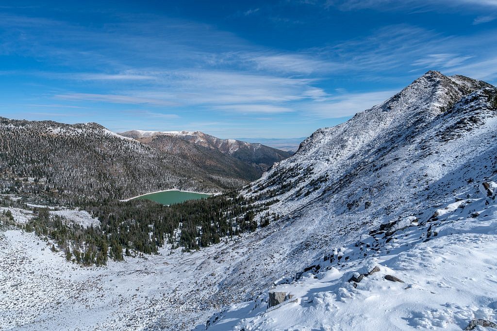 The ridge leading to Branham Peaks on the right and Bell Lake in the basin below. A trail leads to Bell Lake form the east side of the range.