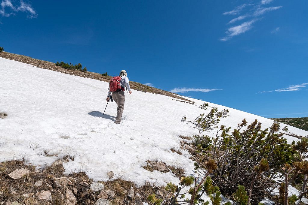 Mike traversing the much smaller and safer snow patch above us.