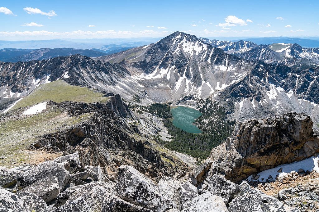 It’s worthwhile to wander over to the cliffs south of Tweedy for a nice view of Torrey Lake and Torrey Mountain. Both Torrey and Tweedy can be climbed from a base camp at this lake.